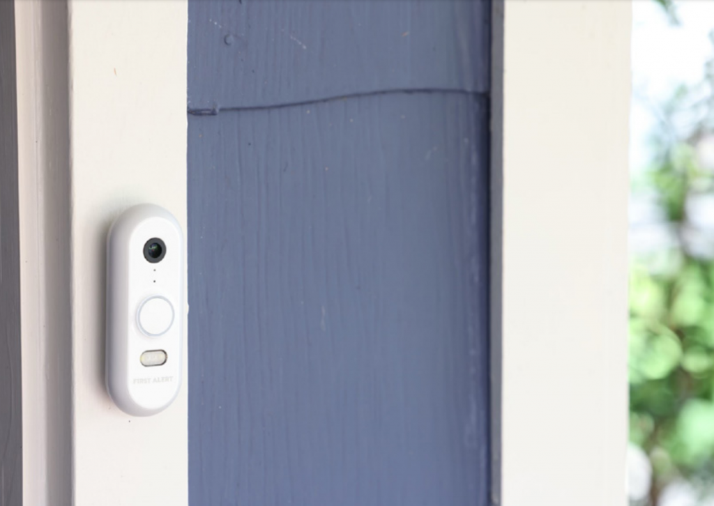 Resideo's First Alert VX1 video doorbell camera installed near front door of home.